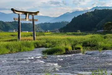 There is a torii gate above the falls and a bit upstream which adds to the atmosphere