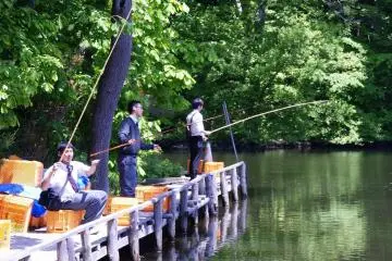 Teenagers angling for fish