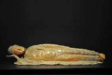 Buddha in Nirvana. 13th century Japanese Buddhist sculpture.