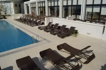 Beautiful beach chairs set along the outside of the hotel's outdoor pool. (Photo: Kathryn Spoor )
