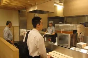 Come over here to get your tray and place your order