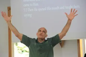 Pastor Chester Carney passionately delivers the sermon in English; though he is fluent in Japanese a deacon translates the sermon for him
