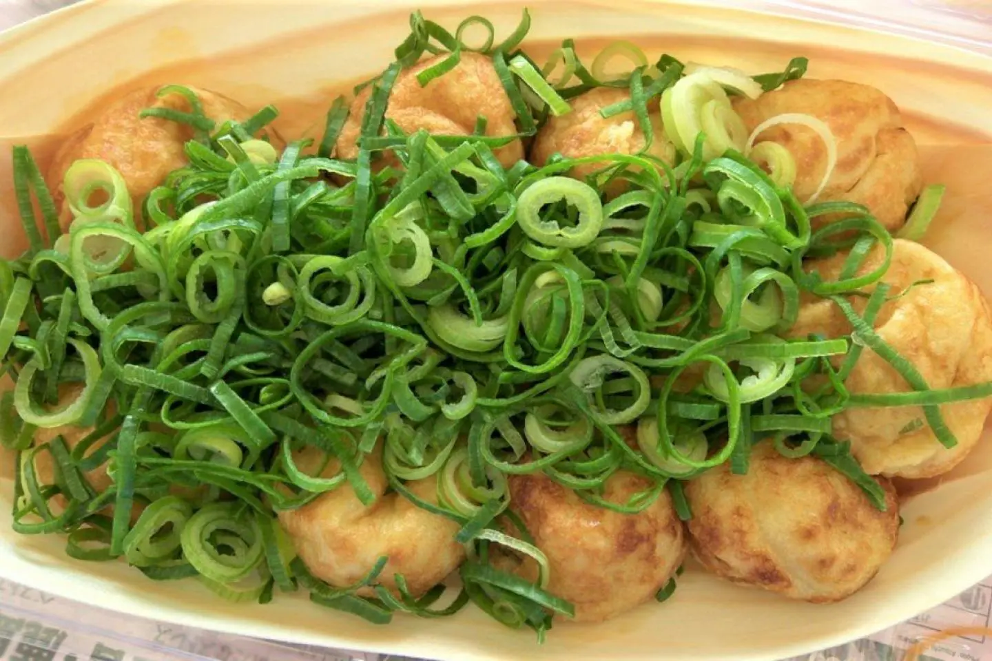 Takoyaki with green onion and ponzu sauce (Photo: nekotank / CC BY-ND 2.0)