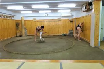 Junior wrestlers leaning up after practice