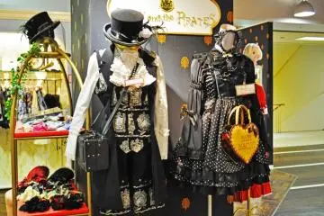 Gothic lolita outfits on display.
