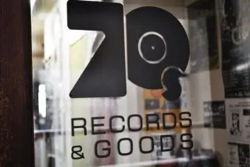 The sign on the door at the entrance.