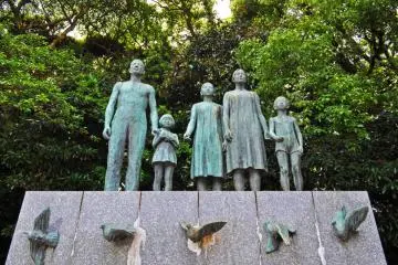 A statue near the entrance of the shrine. I think this statue is dedicated to peace, given that the girl is releasing a dove from her hands. (Photo: Michelle Madden)
