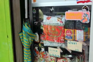 Authentic Thai fish sauce and noodle soups sit in the window.