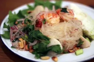 This dish is the glass noodle salad with sticky rice. A lighter dish with lots of flavor.