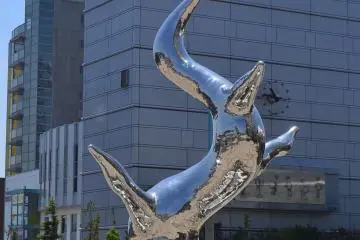 Modern and futuristic statue in front of the Malios Building.