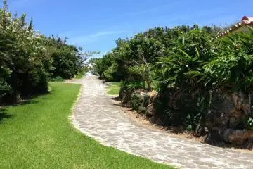 Toguchi Beach Park's paved pathways go up and down the limestone bluffs as well as along the shoreline