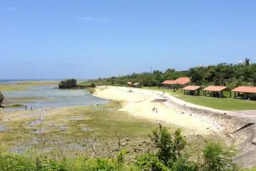 During a full Moon the water isn't that deep, but closer to a new Moon Toguchi Beach Park is a great place to swim