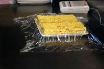 The tamago (egg) gets prepared in the front of the shop where passerbys can watch the chefs' techniques.