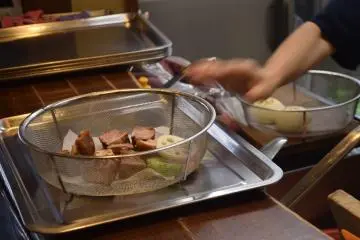 Staff will prepare what you order in wire dishes, ready to place into the steam ovens (Photo: Kim B)