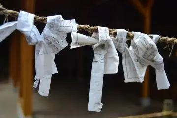 <p>Omikuji. Visitors to the shrine tie their wishes on to the rope.</p>