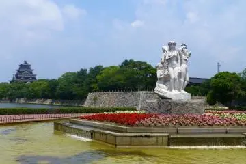 Flowers and a fountain, with the castle in the background