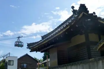 The cable car passes one of the many temples