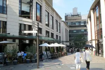 Dining outside of Biz Tower and the official TBS store