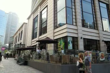 A cafe outside of Biz Tower with TBS headquarters in the back