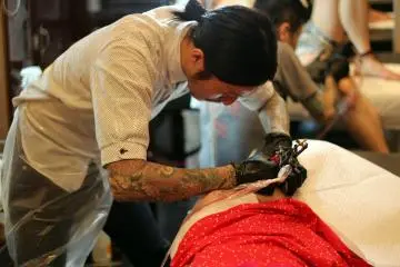 Hiroshi is hard at work tattooing my piece. (Photo: Kevin DeBastos)