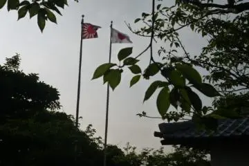 Both flags seen from the monument