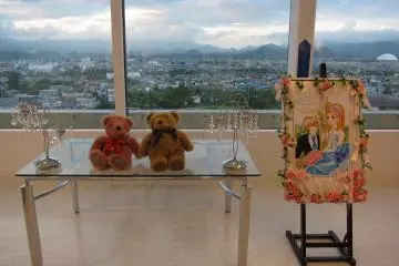 Two lovely bears sit in this well decorated room