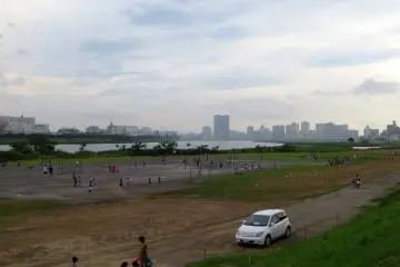 Kids playing soccer in the evening by the trail