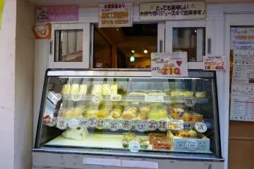 The front window with lots on display in the glass cabinet