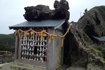 Small altar with fortunes and a "shimenawa" denoting a sacred space