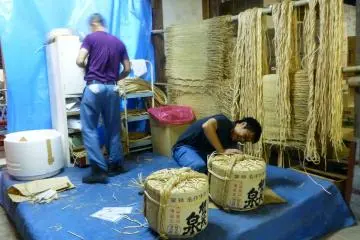 A glimpse into the sake barrel packaging process