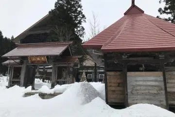 Deep piles of snow cover the ground