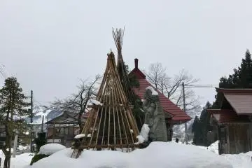Many trees are protected with structures made of sticks - the practice is called yukigakoi