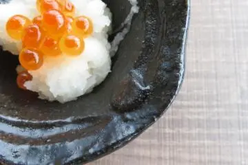 Salmon roe on a bed of shredded daikon radish