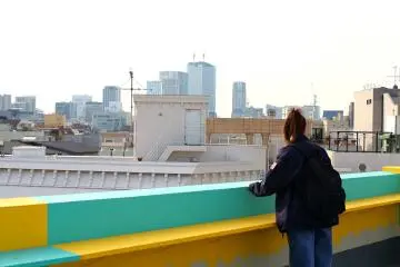 Bright roof terrace with views out across Tokyo
