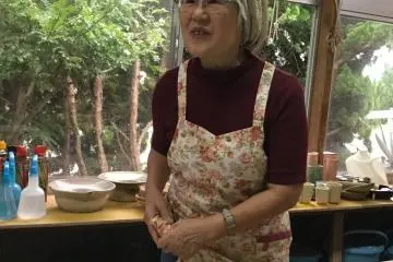 Local artist Kato-san explains the history of natural dyeing.