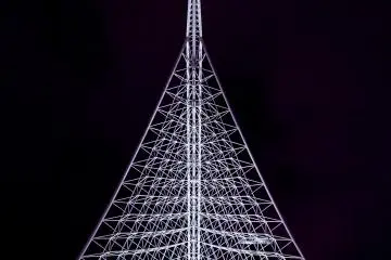 The Kobe Maritime Museum has a distinctive architectural roof that gets lit up at night, revealing a lattice of white steel.