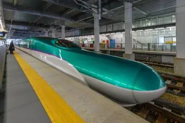 The Hokkaido Shinkansen pulling away from the station
