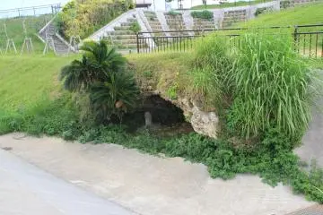 <p>The mysterious small cave contains a marker reading Shichian River but there is no water nearby to prove it</p>