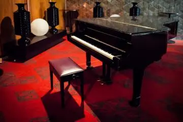 The odd piano sits around the place, adding to the class of the decor.