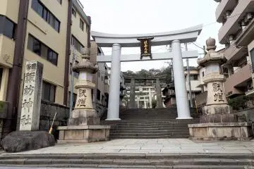 The bottom torii gate on the way to Suwa Shrine. Its solid stone construction lends it a very different vibe to wooden torii.