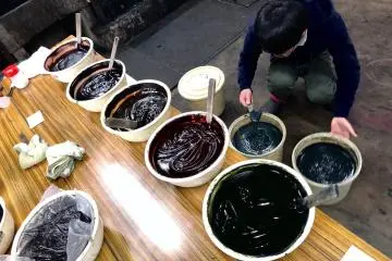A staff hard at work preparing the dyes