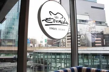 A window seat offers city views within the calm interiors of the restaurant