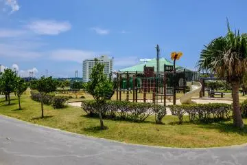 A small childrens playground in the surrounding park