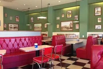 <p>1950s-style decor along with Americana decorations and photographs of Blue Seal's history</p>