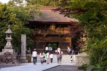 The main temple gate surrounded by late summer foliage