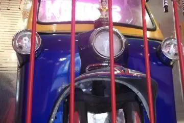 Look for the gaudy tuk-tuk at the top of the steps
