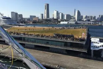 Waving goodbye to well wishes on port.