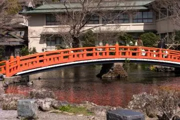 A bridge to a small shrine passes over the Gushing Jewels Pond
