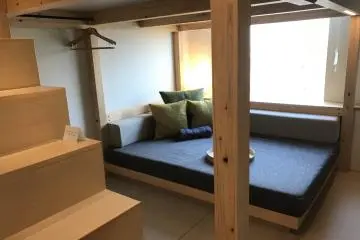 The sitting area underneath the loft bedding