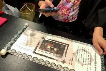 Scan the QR code on your scroll to download the video